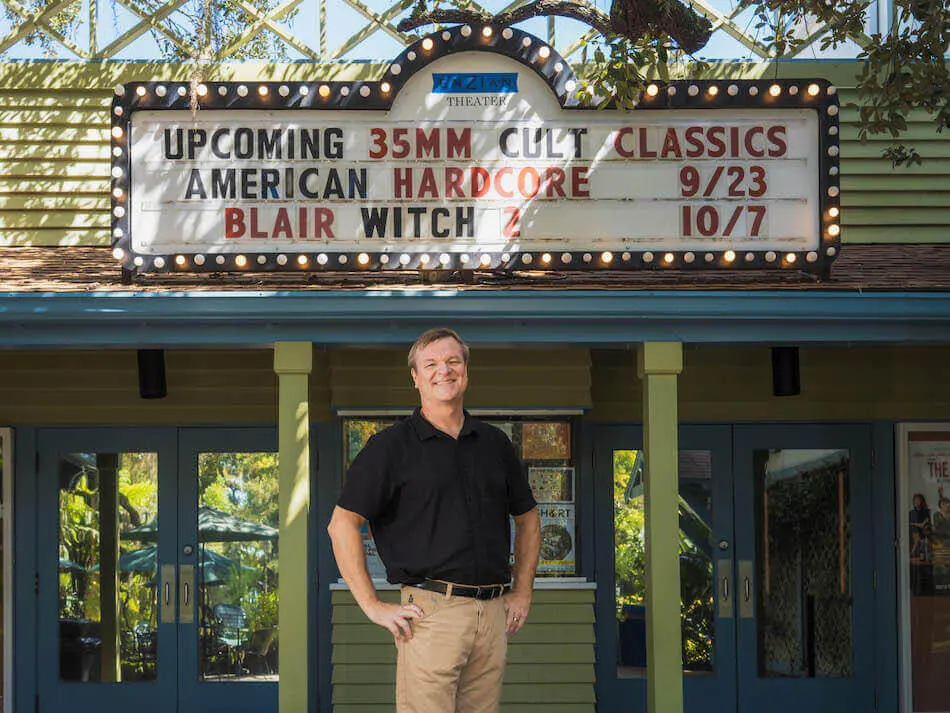 Executive Director Wade Neal stands beneath the 35mm marquee at Enzian Theater in Maitland, Florida.
