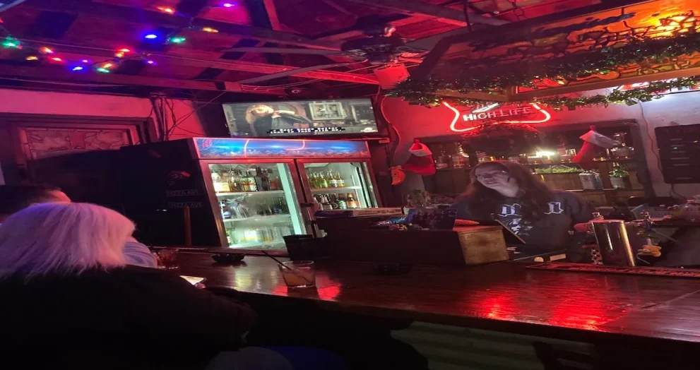 Bartender serving drinks at Muldoon’s Saloon in Winter Park, a longtime Central Florida musician’s bar