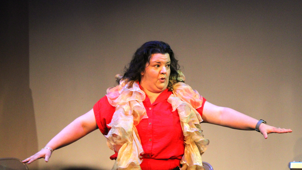 Diane Jorge in Solovela on Fringe Festival Orlando stage with arms extended