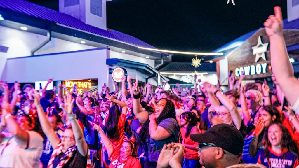 Supporters celebrate a U.S. goal at Pointe Orlando's FIFA World Cup watch party.