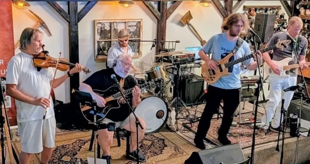 Members of The Rusty Strings performing live during a Grateful Dead-inspired concert in Central Florida.