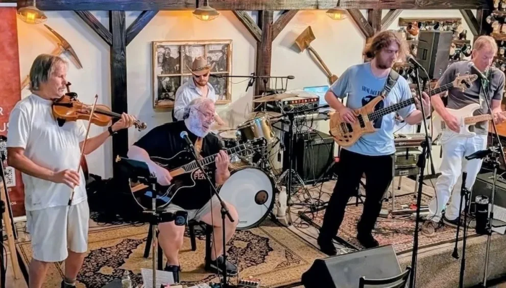 Members of The Rusty Strings performing live during a Grateful Dead-inspired concert in Central Florida.